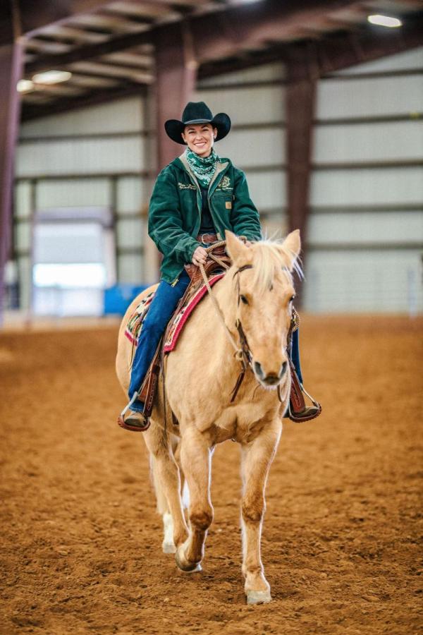 Woman Smiling on Horseback